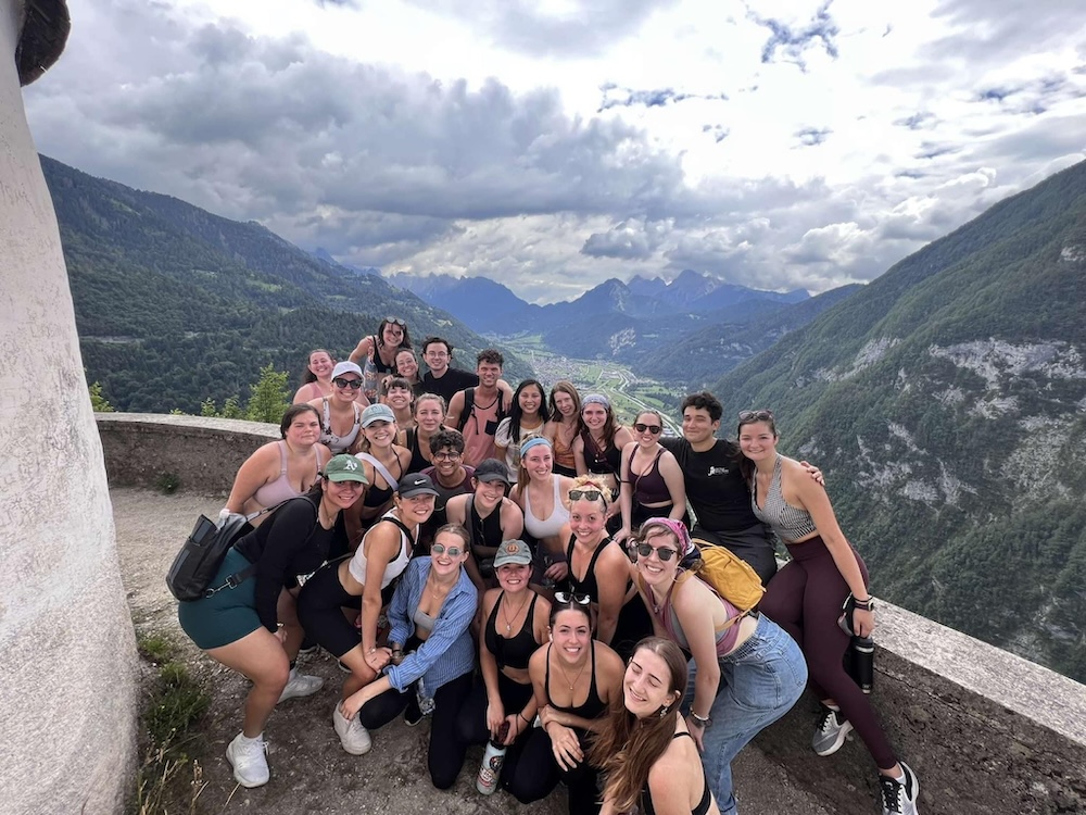 Group of people at a high altitude smiling together